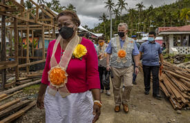 Dr Kanem walks through area hit by Typhoon Rai in the Philippines